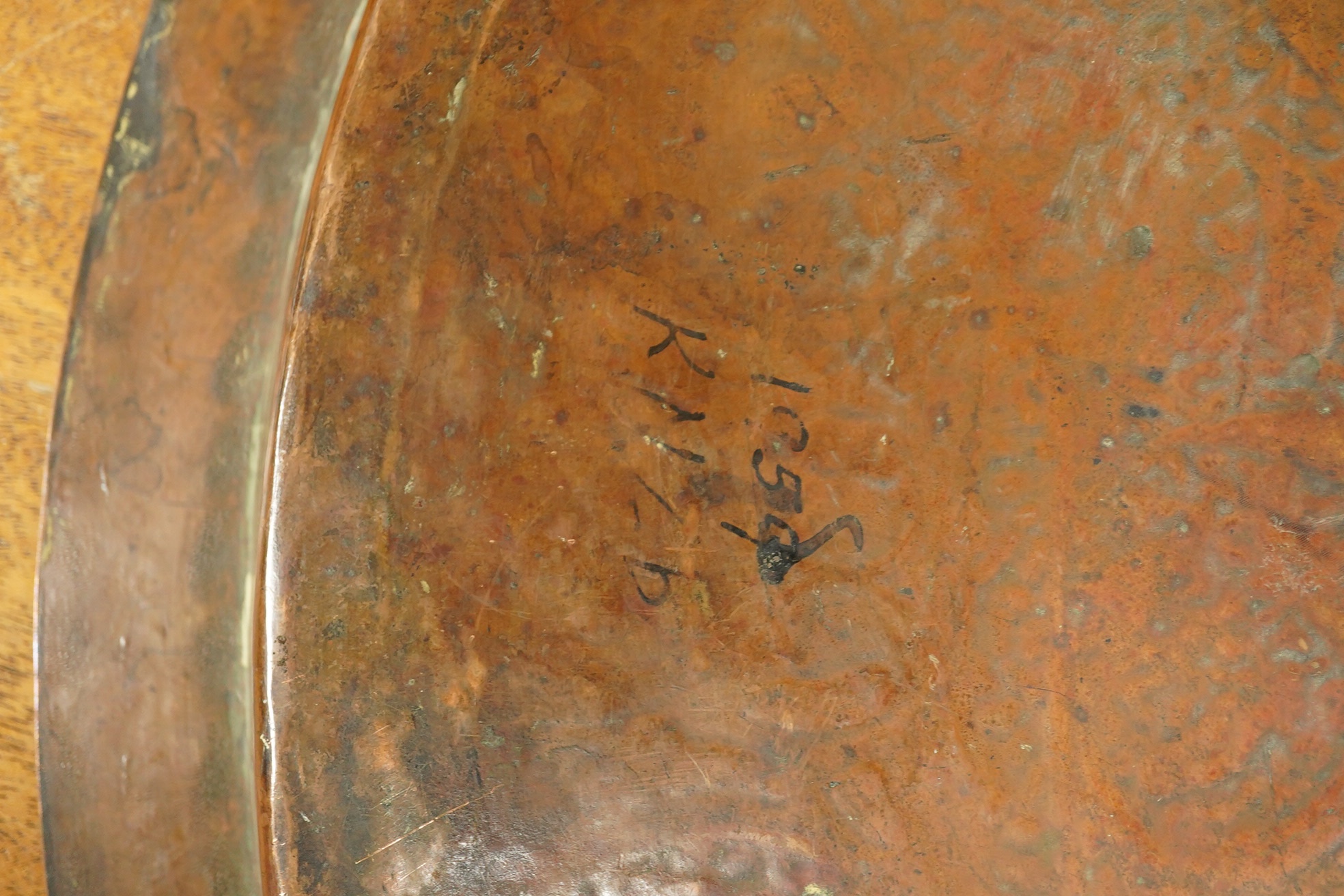 A Middle Eastern circular copper and niello damascened tray, 50cm in diameter. Condition - good